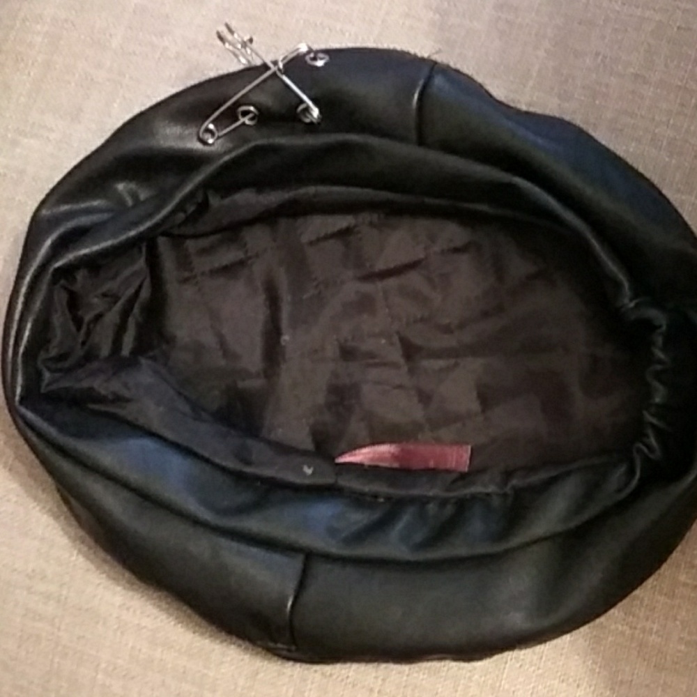 Biker cap with safety pin design